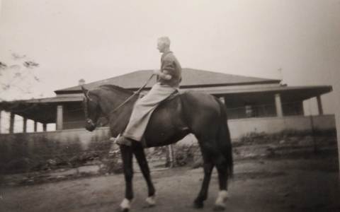 Grandpa Ken on his horse outside Hay Lodge